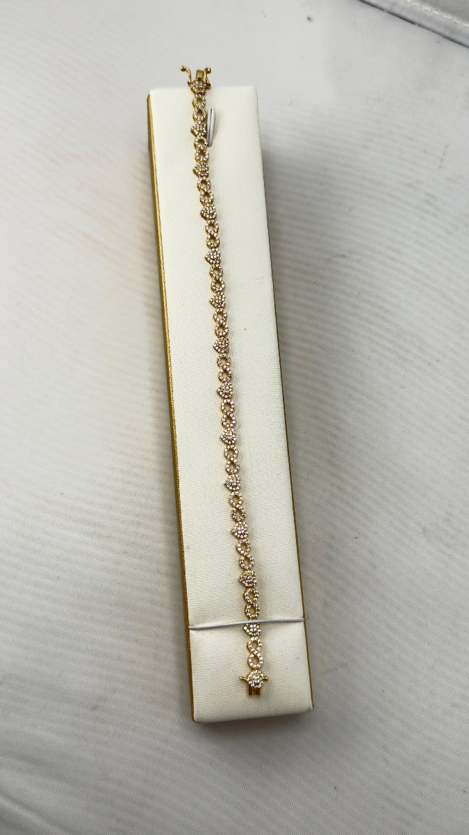 14K bracelet green heart y el otro es infinito con heart